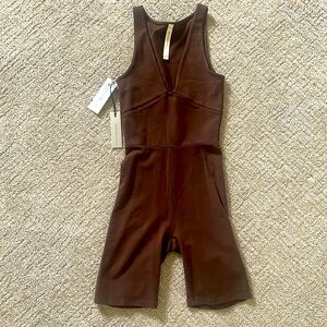 Never worn Aritzia deep V short jumpsuit. Rich mocha brown 2xs